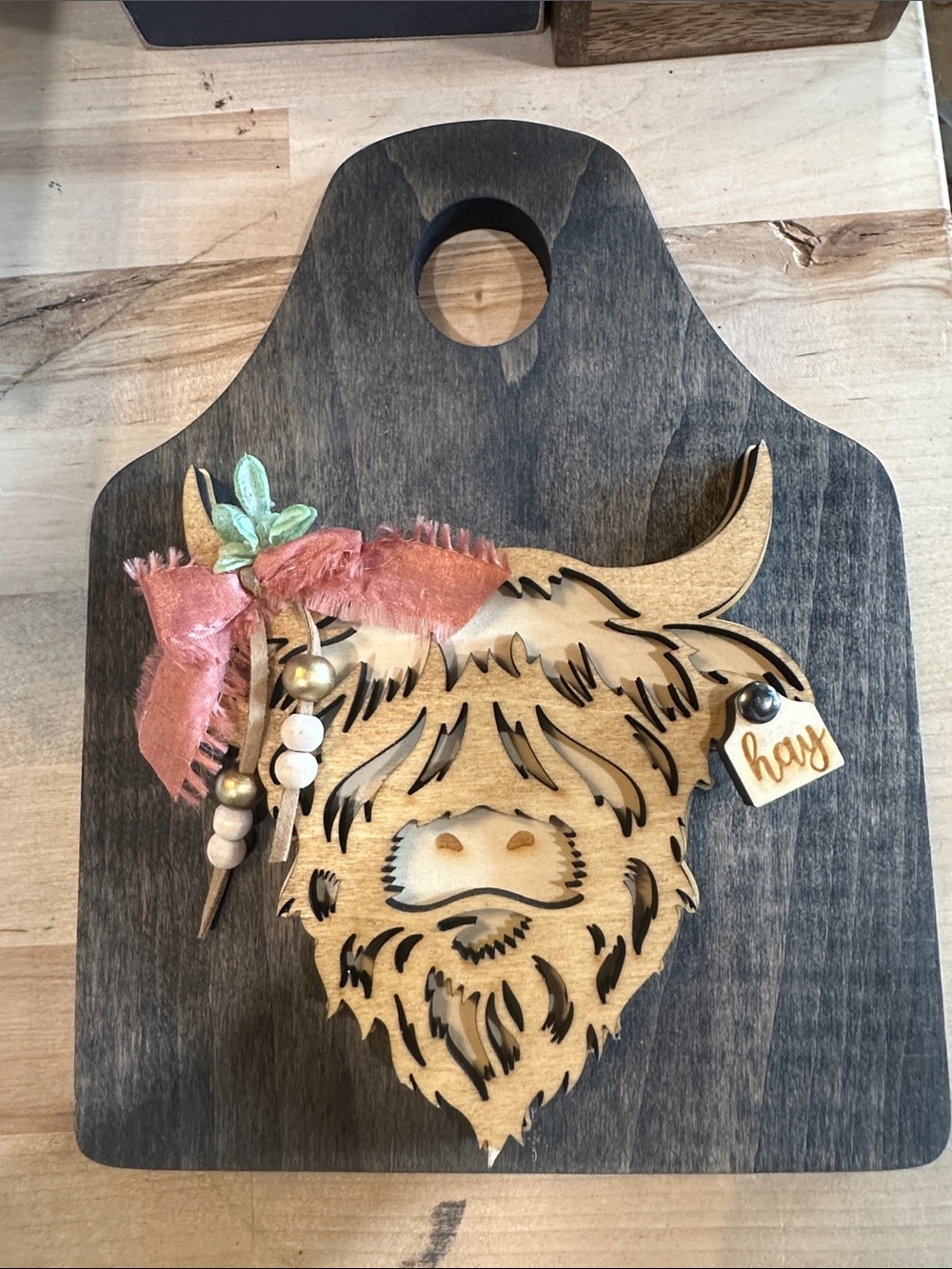 Wooden Highland Cow Wall Accent with Pink Ribbon Detail